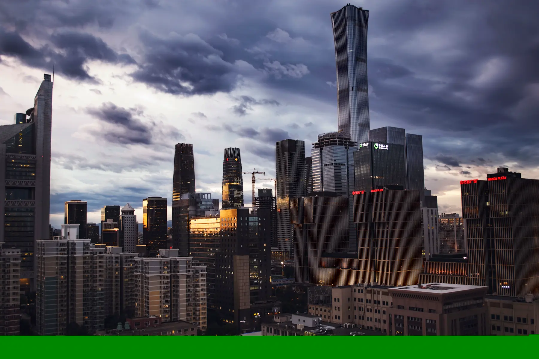 Beijing’s contemporary skyline beneath dramatic clouds