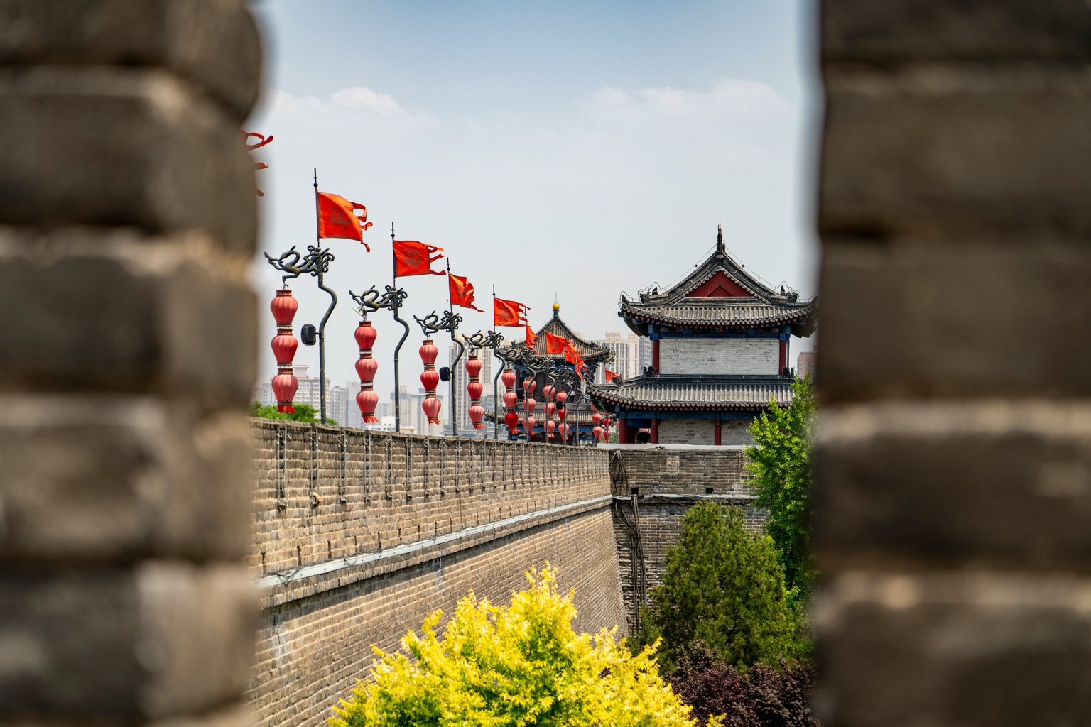 The Xi’an city wall and watchtowers framed through a masonry opening