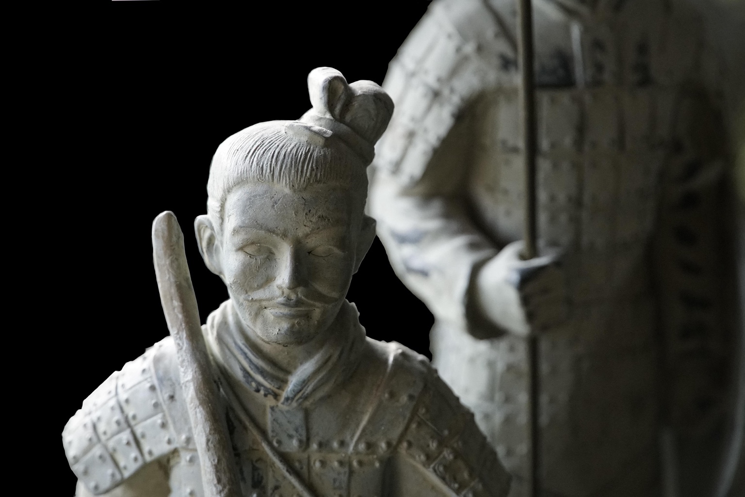 Close view of a Terracotta Army archer’s face and armour