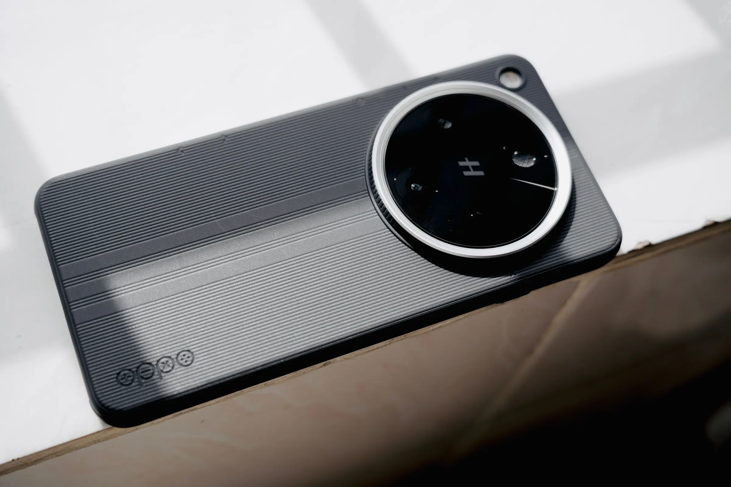 An Honor smartphone held against a dark background